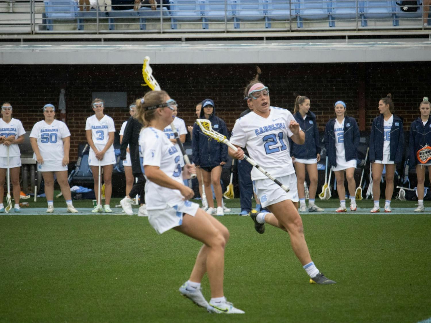 UNC first-year attacker Marissa White (21) runs down the field during the women’s lacrosse game against Clemson at Dorrance Field on Sunday, March 26, 2023. UNC beat Clemson 17-8.