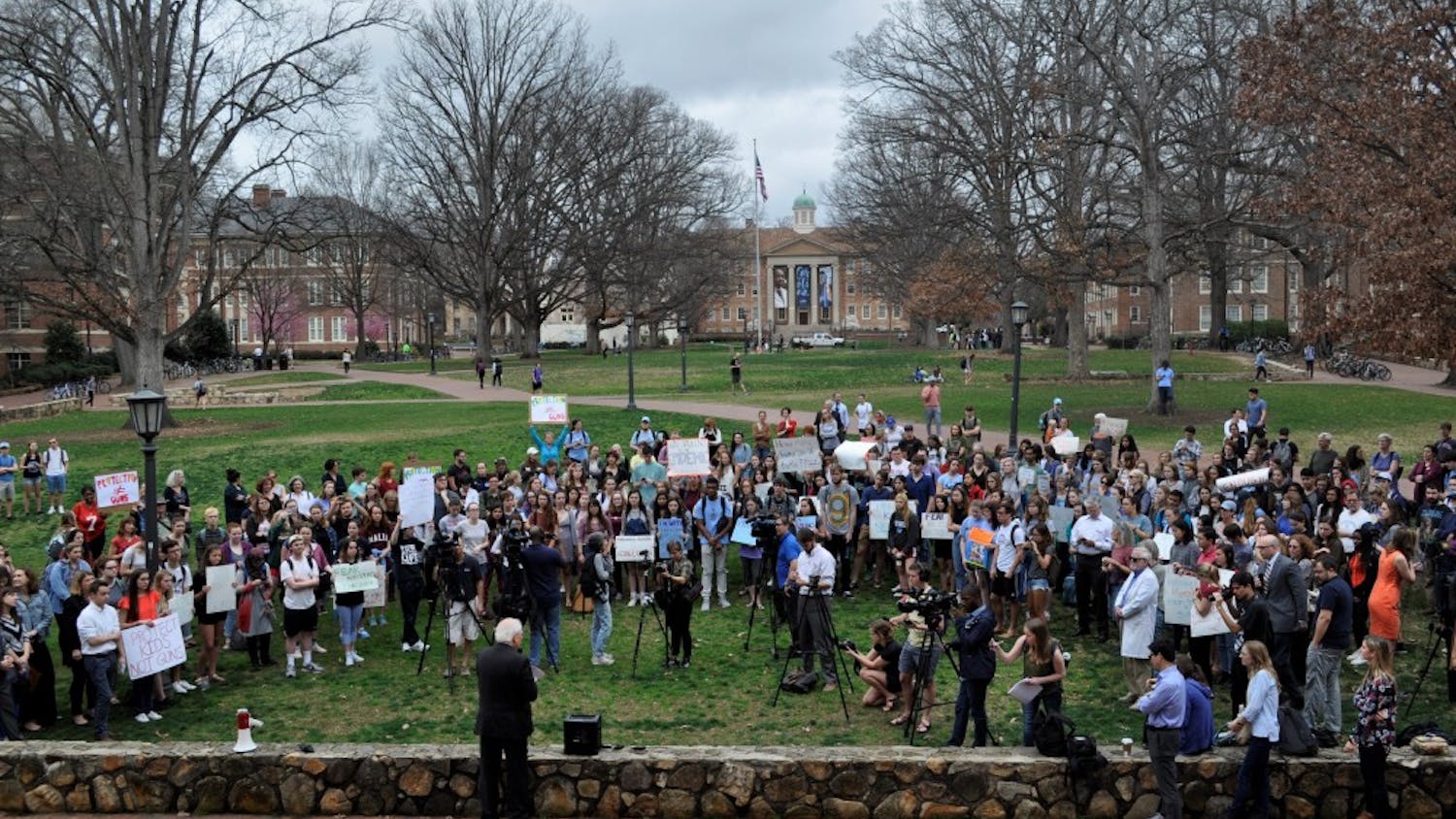 Students gather in front of Wilson Library to protest gun violence on Thursday morning.
