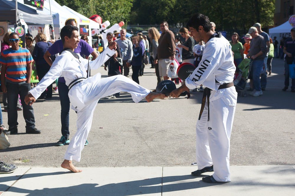Tae Kwon Do United Academy showcase their student's skills during the Festifall event held on Franklin St. Sunday afternoon. 