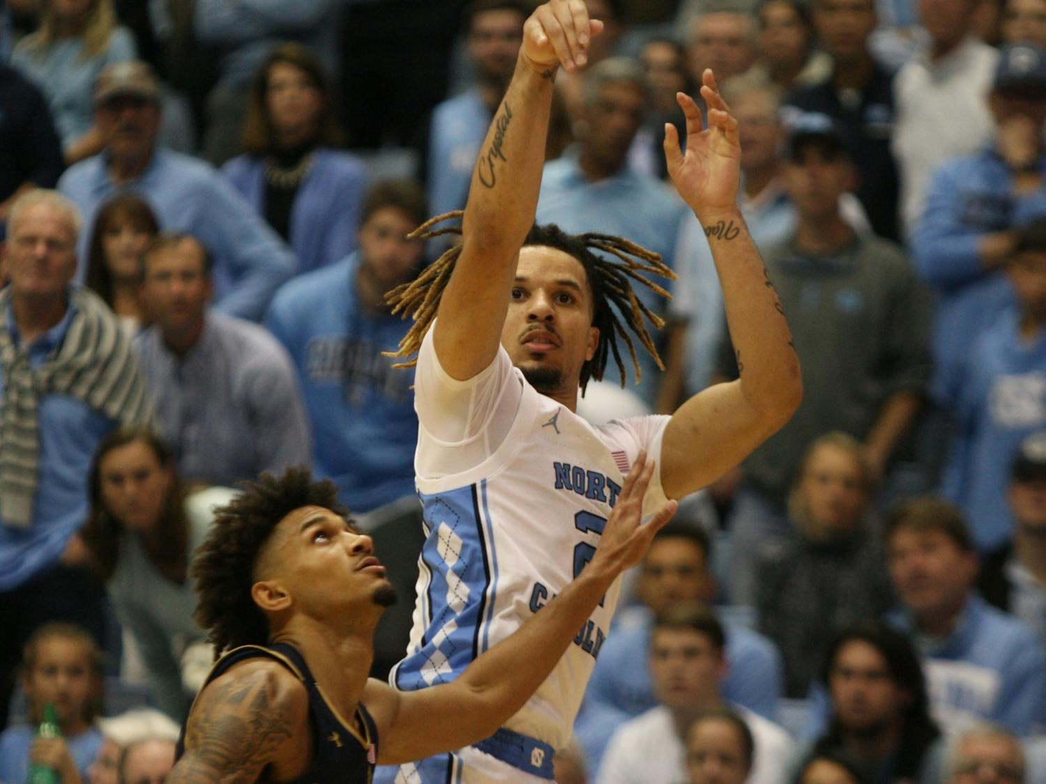 UNC guard Cole Anthony (2) shoots over Notre Dame's Prentiss Hubb (3) on Wednesday, Nov. 6, 2019 in the Dean E. Smith Center. Anthony finished the game with 34 points and 11 rebounds. The Tar Heels beat the Fighting Irish 76-65.