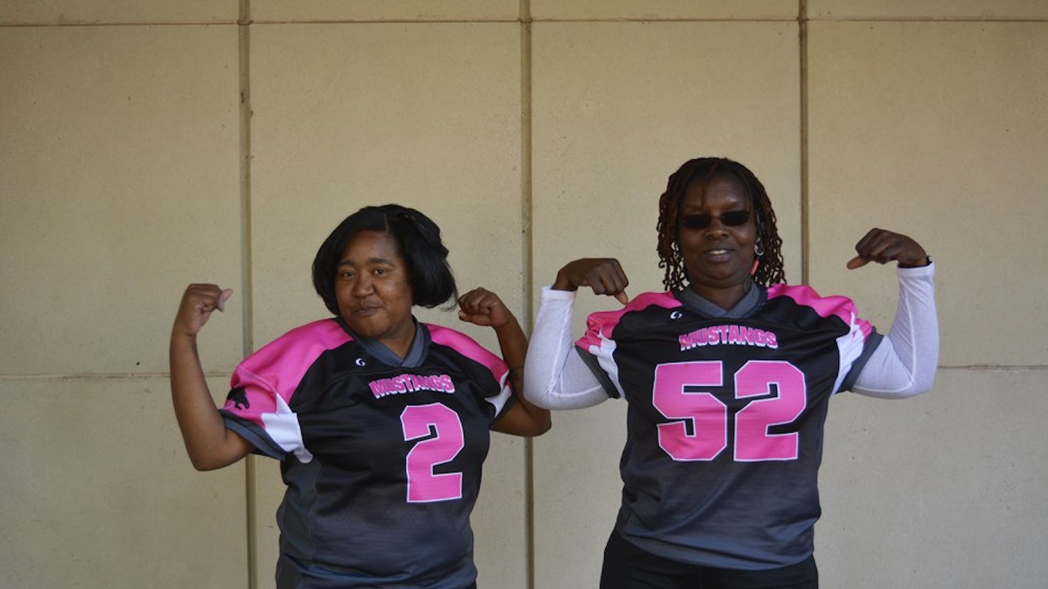 McDougle Middle School's football team, with help from Team Moms BLANK (left) and BLANK, raised money for pink uniforms and a donation to the Susan G. Komen Foundation, in support of Breast Cancer Awareness.