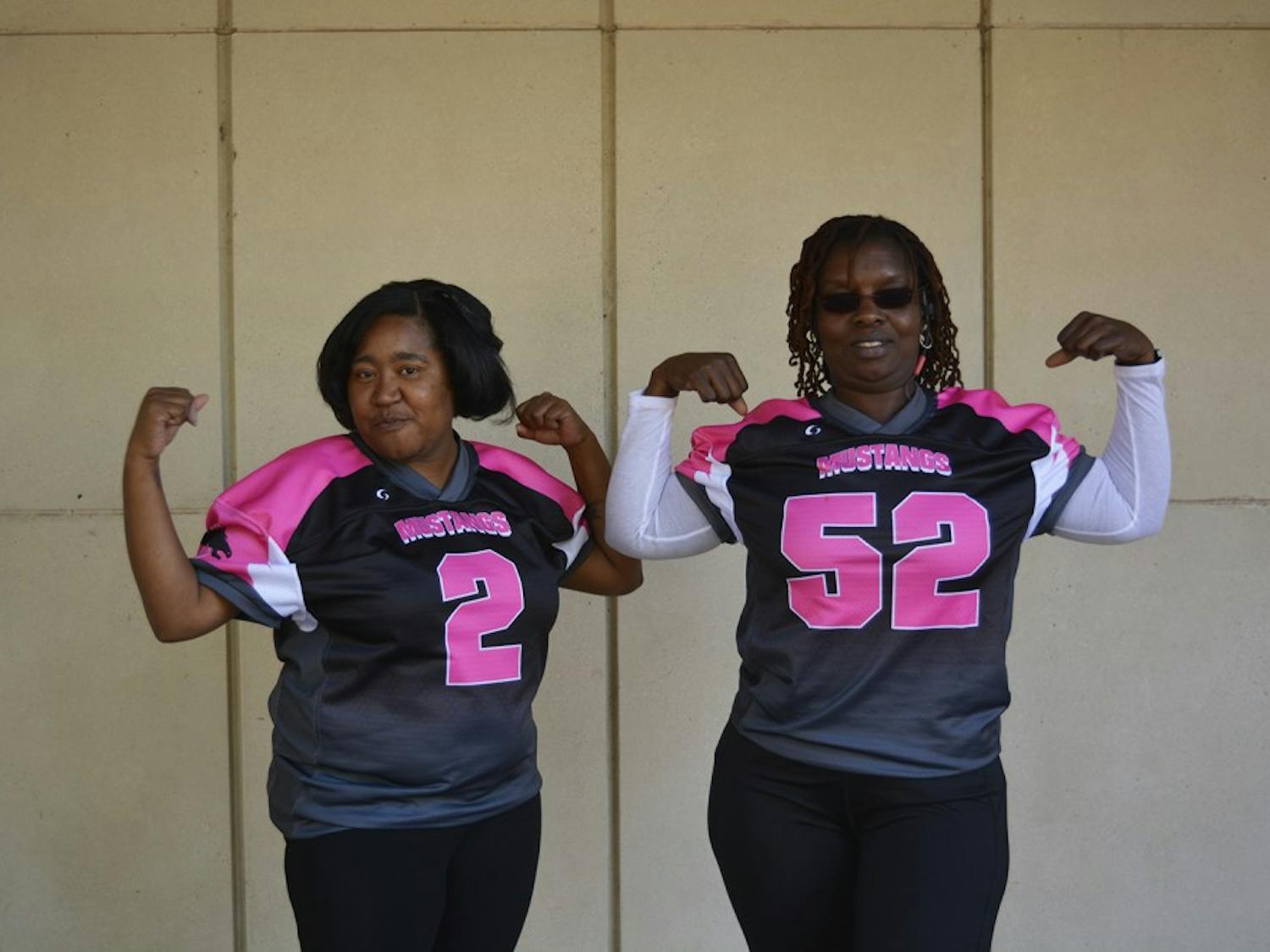 McDougle Middle School's football team, with help from Team Moms BLANK (left) and BLANK, raised money for pink uniforms and a donation to the Susan G. Komen Foundation, in support of Breast Cancer Awareness.