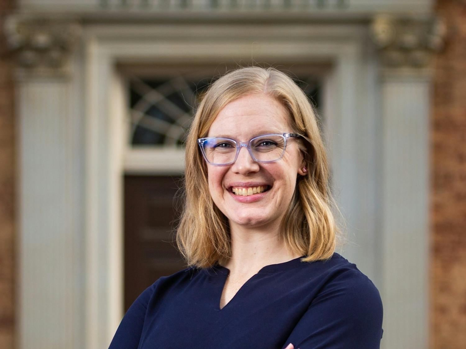 Lauren Hawkinson, president-elect of the Graduate and Professional Student Government, poses in front of the South Building in Chapel Hill, N.C. on Sunday, March 26, 2023.