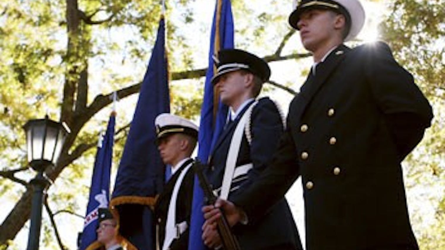 The ROTC color guard stands ready near Memorial Hall before the commencement of the Veterans Day ceremony in&nbsp;2013.