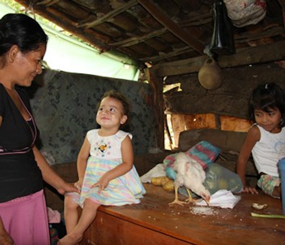 Maria Digna Ramos Mendoza cares for her five children in their crowded one-room hut in the mountains of southwestern Honduras. 