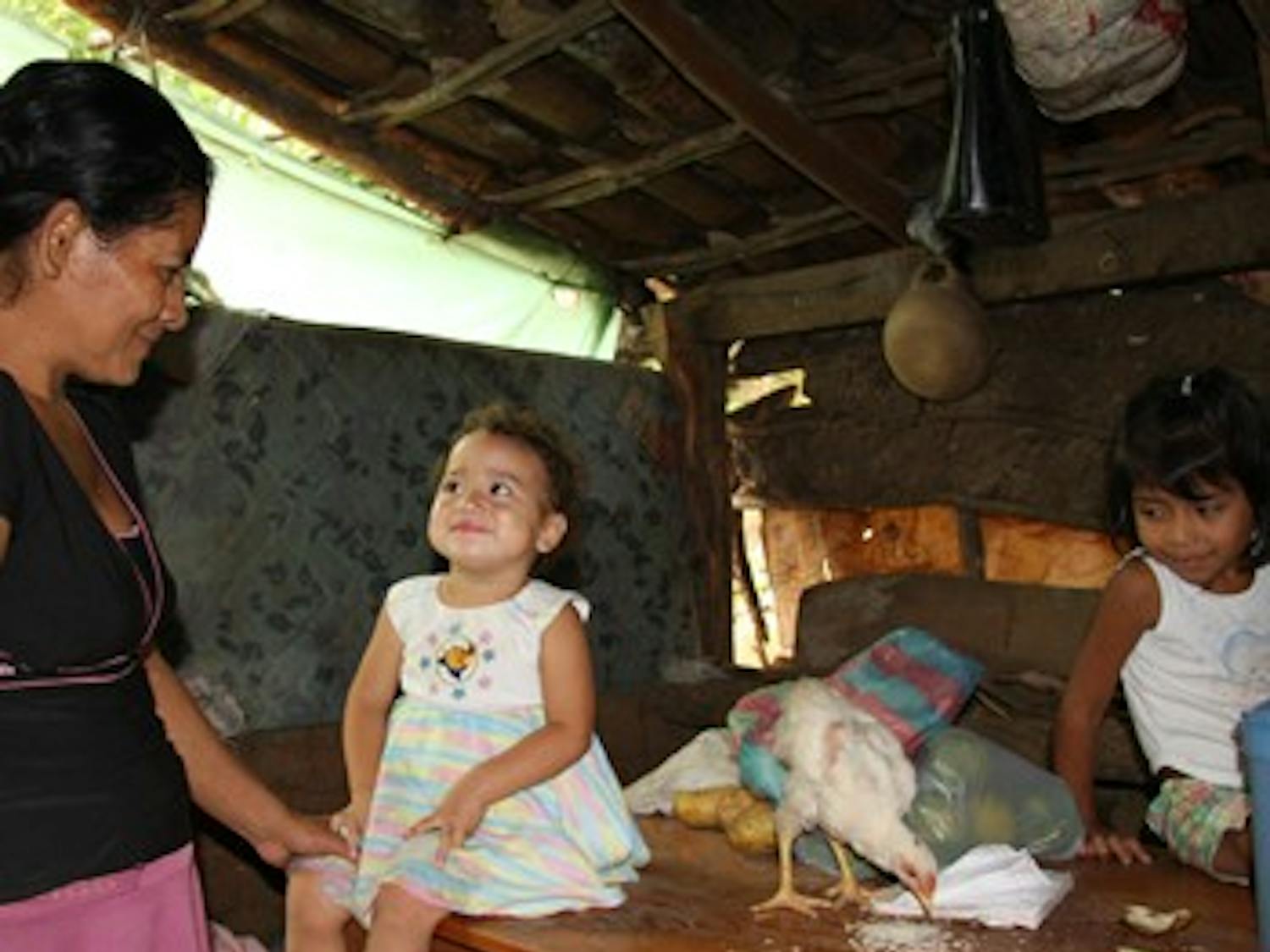 Maria Digna Ramos Mendoza cares for her five children in their crowded one-room hut in the mountains of southwestern Honduras. 