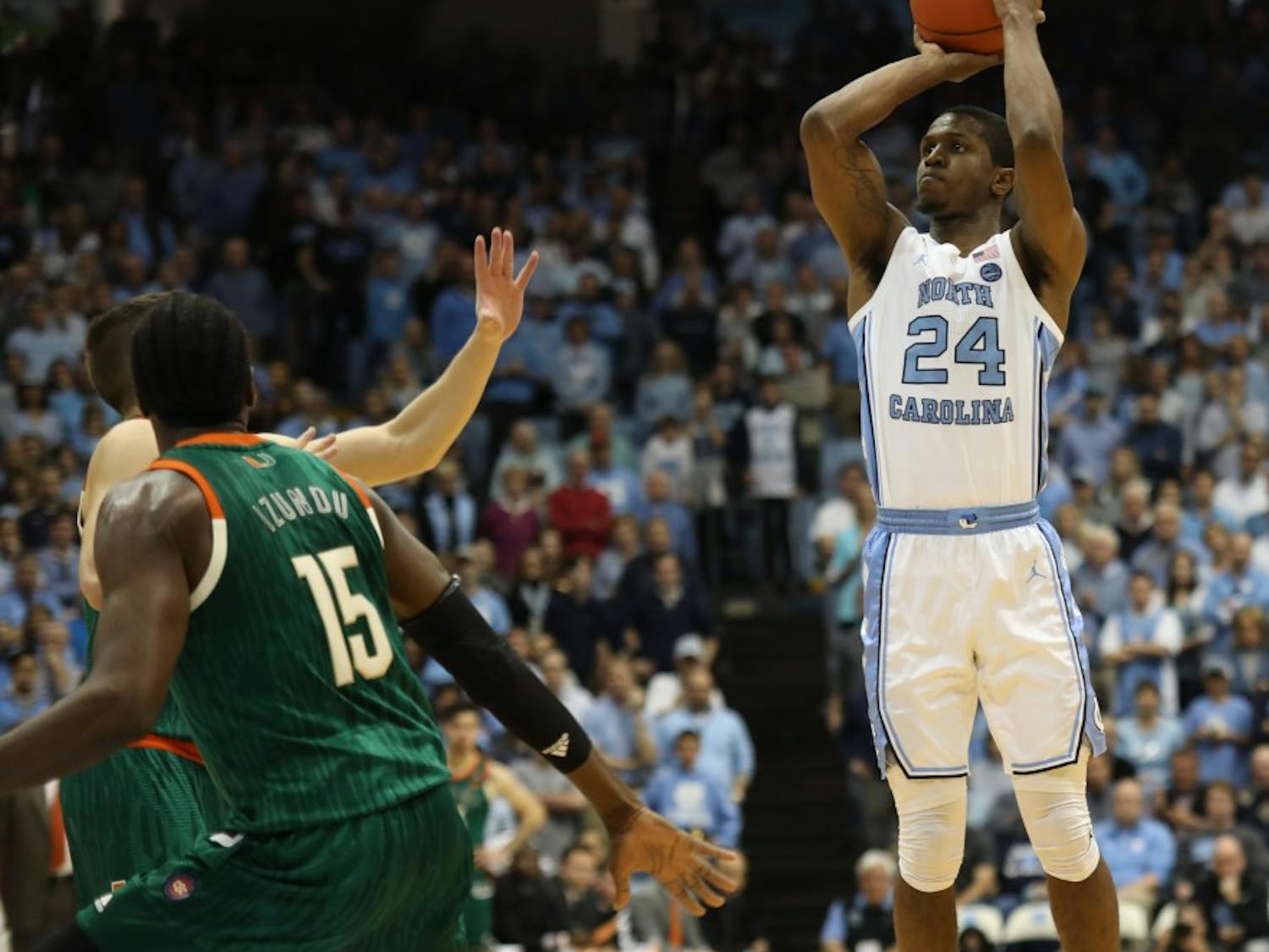 UNC senior guard Kenny Williams (24) shoots a three-pointer against Miami on Saturday, Feb. 9, 2019 in the Smith Center. UNC men's basketball defeated Miami 88-85 in overtime.