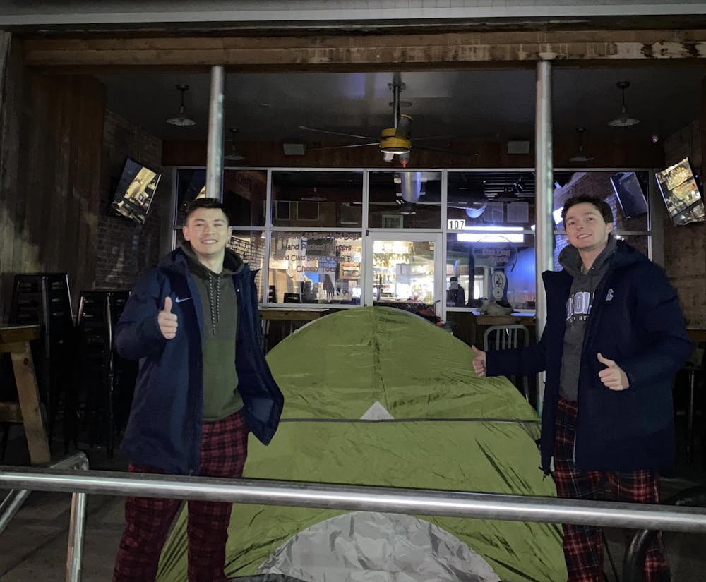 <p>Will Palazzolo and Anders Hartmark were two of many North Carolina men's basketball fans who camped outside of Sup Dogs into the morning of Wednesday, March 30, 2022 to secure a reservation for the Final Four game. Photo courtesy of Will Palazzolo.</p>