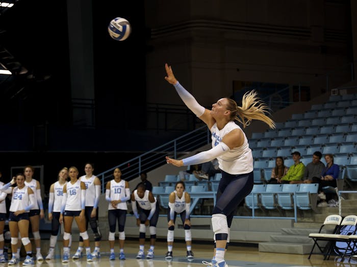 UNC graduate student outside hitter Charley Niego (5) hits the ball during the volleyball match against the University of Miami on Friday, Sept. 30, 2022, at Carmichael Arena. UNC lost 1-3.