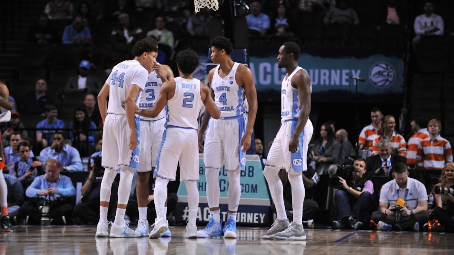 The Tar Heels huddle between play during the game against Miami on Thursday. UNC is the No. 1 seed in the South region for the NCAA tournament.&nbsp;