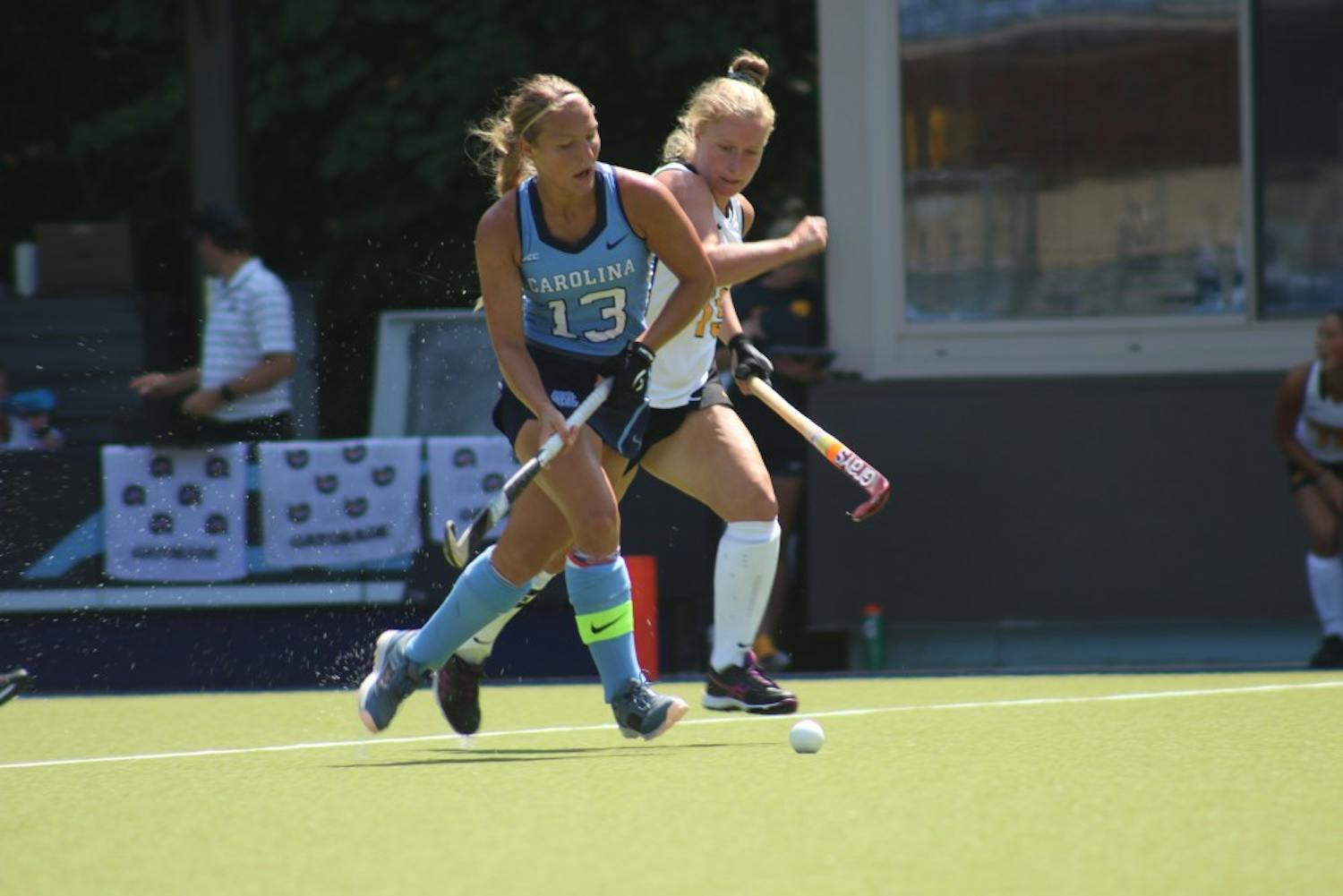 Senior defender Ashley Hoffman (13) boxes out a defender during UNC's 2-1 win over Iowa at Carolina Field Hockey Stadium on Aug. 26.