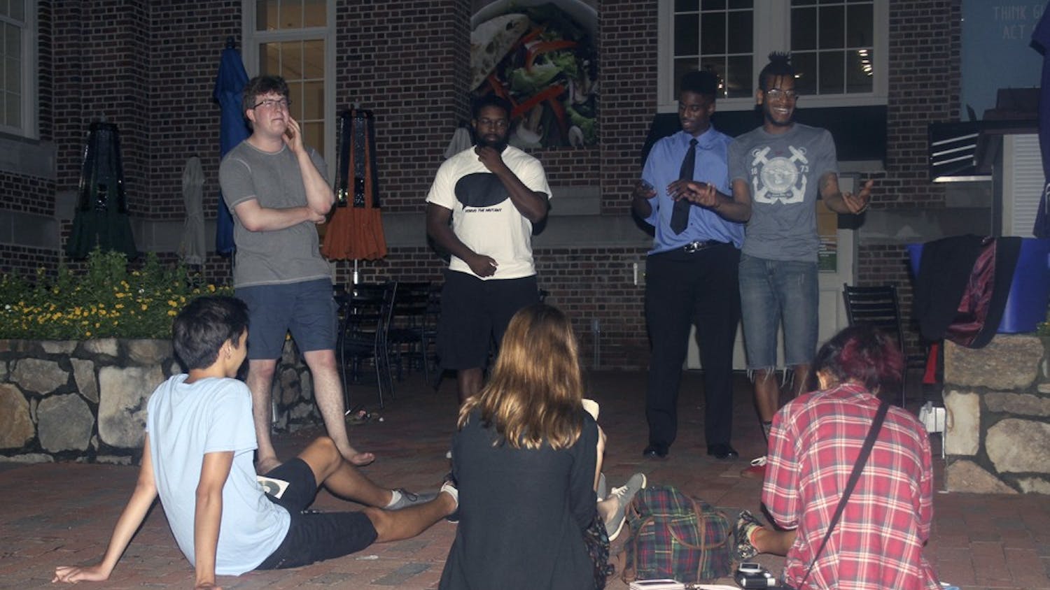 Students participate in a freestyle hip-hop cypher on Wednesday night.