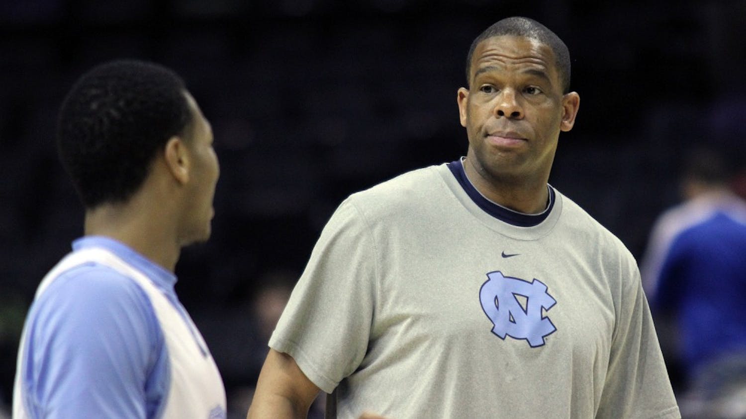 Assistant coach Hubert Davis raises his eyebrows at Nate Britt during practice. The UNC men's basketball team held an open practice at the AT&T Center in San Antonio on Thursday. The Tar Heels will face Providence in the second round of the NCAA tournament on Friday.