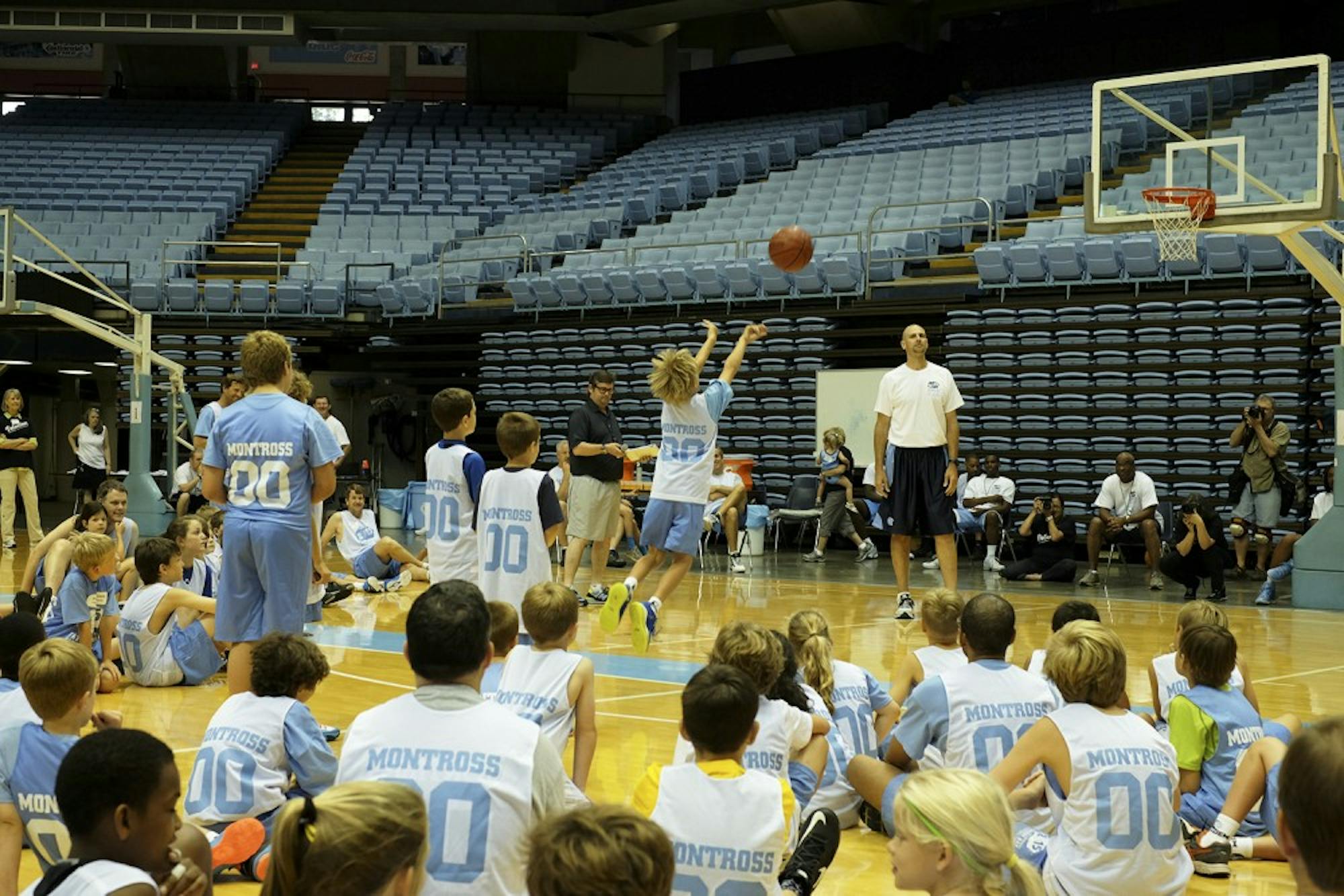 Eric Montross overlooks a free throw competition at the Eric Montross Father's Day Basketball Camp.