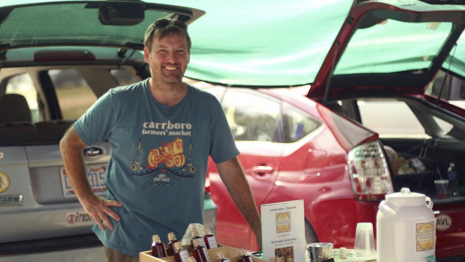 Marty Hanks, owner of Just Bee Apiary, sells his honey producst at the Carrboro Farmer’s Market on Wednesday afternoon.