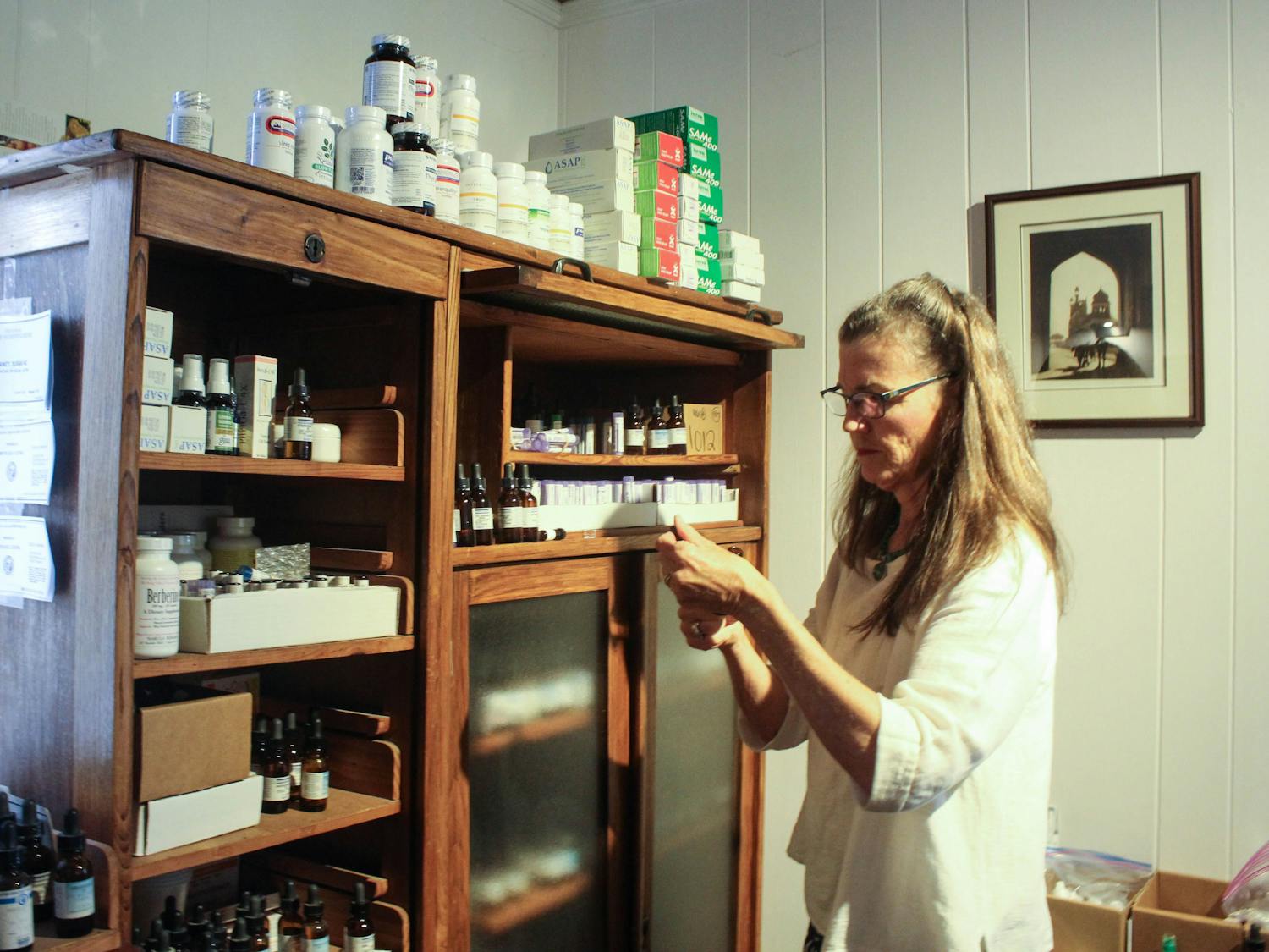 Dr. Susan DeLaney, 66, of Chapel Hill, working in her office on Saturday, Oct. 5, 2019 at The Wellness Alliance in Carrboro. DeLaney is a naturopathic general practitioner and uses natural medicines to treat various ailments.