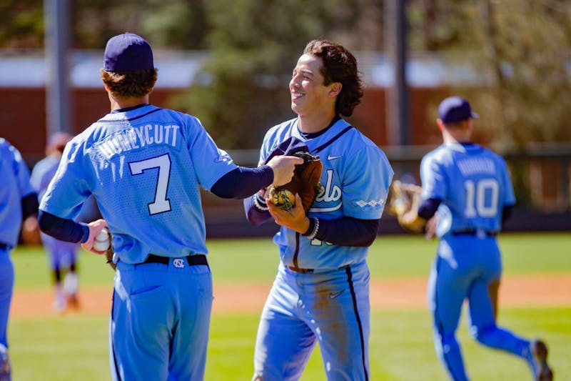 CHARLOTTE, NC - MAY 24: Angel Zarate (40) of the North Carolina Tar Heels  rounds third base towards home during the ACC Baseball Championship  Tournament between the between the North Carolina Tar