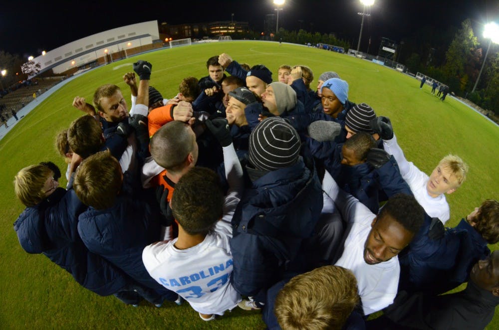 The UNC Men's Soccer team huddles up after defeating Duke 1-0 in the quaterfinals of the 2012 ACC Tournament. 