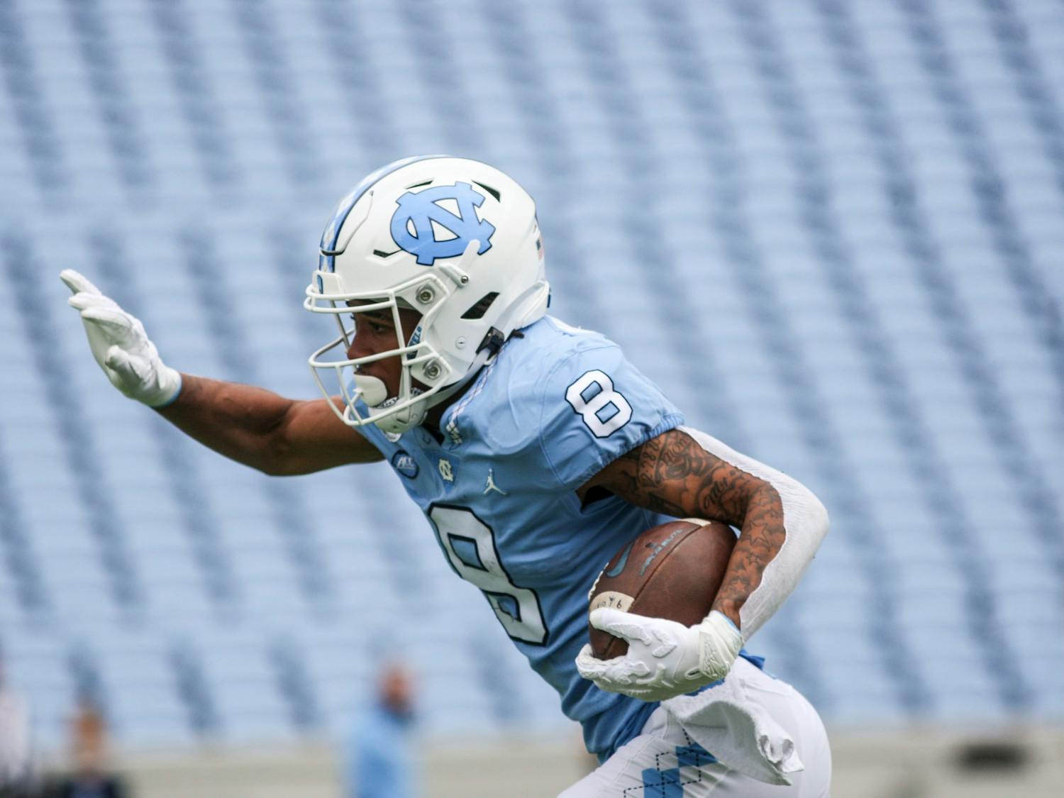 Redshirt freshman wide receiver Kobe Paysour sprints up the field with the ball in the Spring Game on Saturday, April 9, 2022. The Tar Heels and Carolina tied, 14-14.
