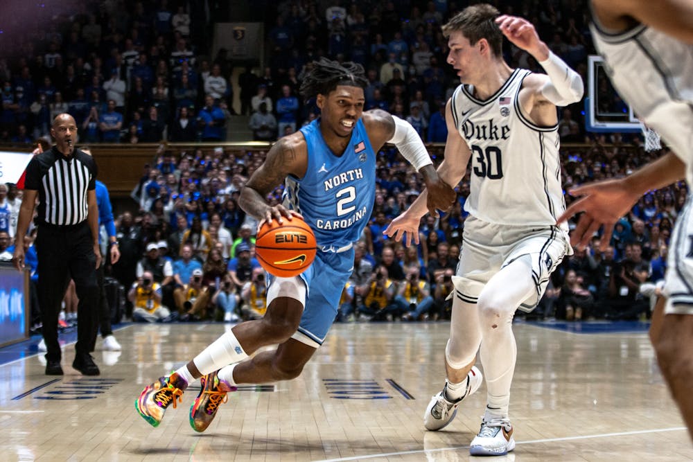 UNC junior guard Caleb Love (2) dribbles the ball during the men's basketball game against Duke on Feb. 4, 2023 at Cameron Indoor Stadium. UNC lost 63-57.
