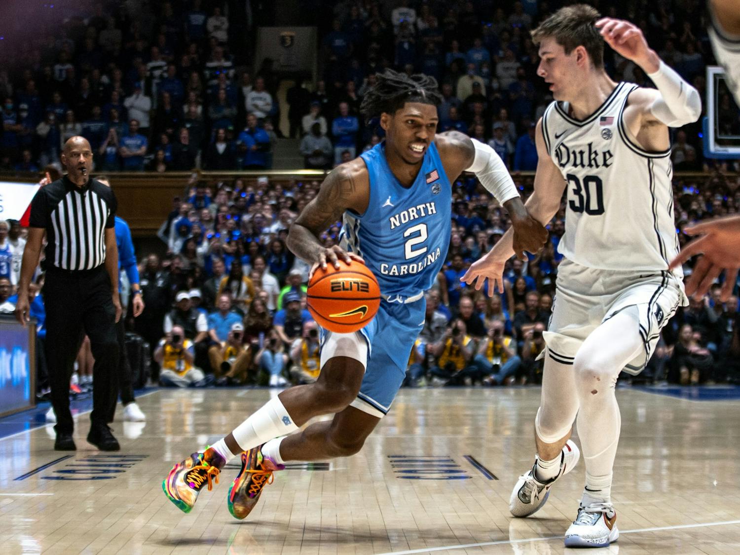 UNC junior guard Caleb Love (2) dribbles the ball during the men's basketball game against Duke on Feb. 4, 2023 at Cameron Indoor Stadium. UNC lost 63-57.