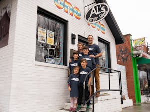 Charlie Farris, the new owner of Al's Burger Shack, poses with his family outside of the restaurant on Sunday, Jan. 8 in Chapel Hill, North Carolina.
