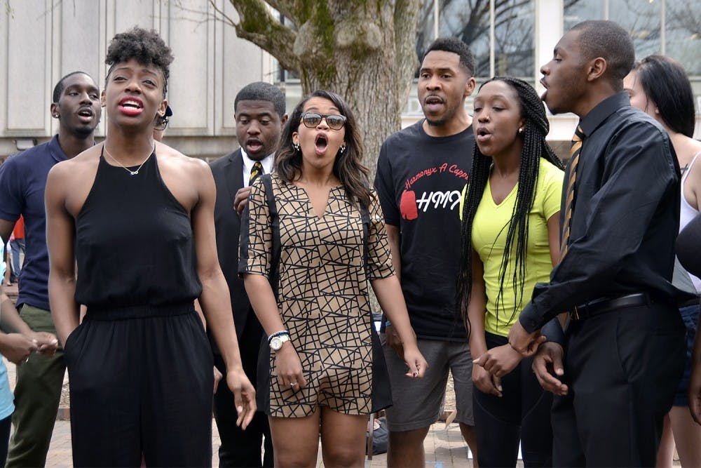 Harmonyx, an acapella group on campus, is celebrating their 20th anniversary this Friday with a concert. Erika Baker, a senior biology major, sings a new song in the pit on Friday afternoon. She explained that the best part of Harmonyx is "hanging out with some really great, genuine people."