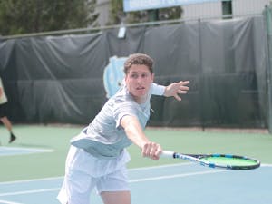 Junior Blaine Boyden competes against Wake Forest on March 28 at the Cone-Kenfield Tennis Center.