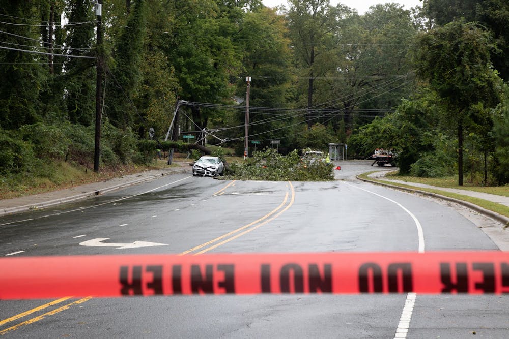 A fallen tree blocks South Columbia St. near Westwood Dr. on Saturday, Oct. 1, 2022, the day after Hurricane Ian made its way through Chapel Hill.