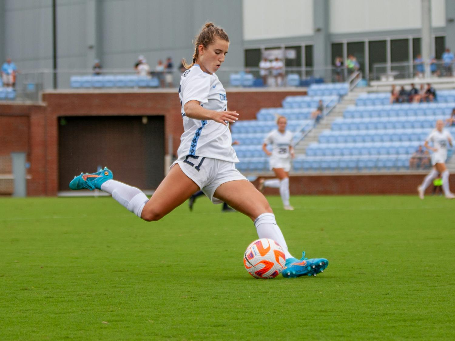Redshirt first-year Ally Sentnor (21) shoots the ball at Dorrance Field on Aug. 21, 2022. UNC won 2-0.&nbsp;