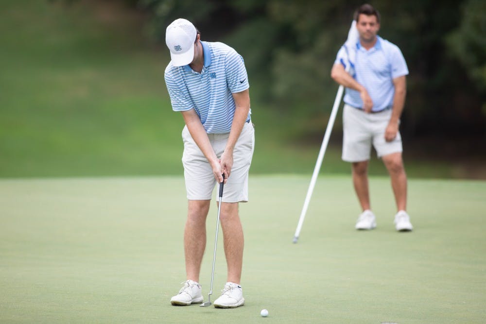 <p>Ryan Burnett putts in the green at the Rod Myers Invitational at the Duke University Golf Club on Sunday, September 15, 2019.&nbsp;</p>