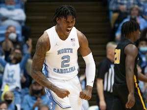 Sophomore guard Caleb Love (2) celebrates after scoring at the game against Appalachian State on Dec 21, 2021 at the Dean E. Smith Center. UNC won 70-50.