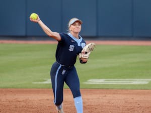 First year utility player Alex Brown (5) throws the ball towards first base in a home game against NC Central. UNC won 8-0 against North Carolina Central University on Wednesday, April 20, 2022.