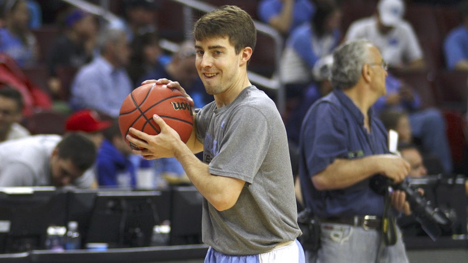 Manager Forrest Reynolds passes the ball during warm ups before the Elite Eight game against Notre Dame. UNC won 88-74.
