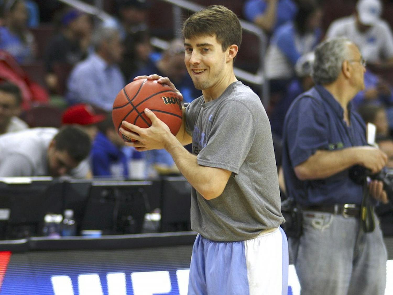 Manager Forrest Reynolds passes the ball during warm ups before the Elite Eight game against Notre Dame. UNC won 88-74.