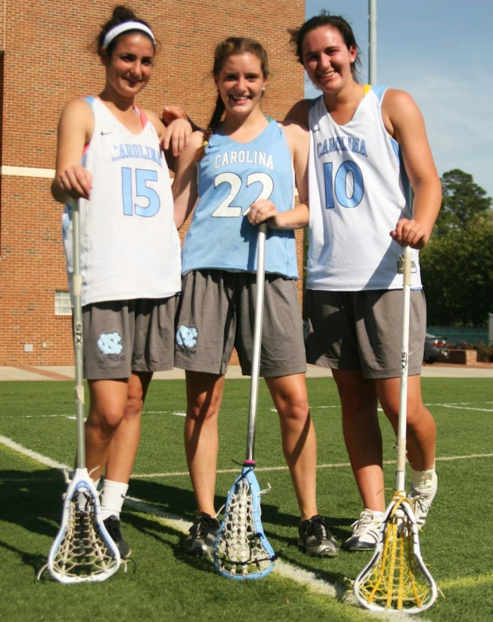 Kara Cannizzaro, Emily Garrity and Jessica Griffin have helped the North Carolina women’s lacrosse team. DTH/Shar-narne’ Flowers