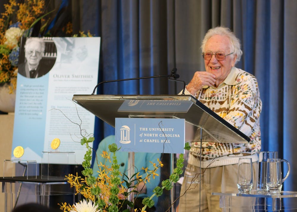 Dr. Smithies, Nobel Prize winner and UNC professor, spoke at a ceremony in Davis library honoring his and Dr. Sancar's achievements, a fellow UNC professor and Nobel Prize winner.