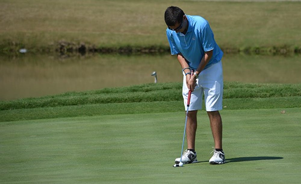 Brandon Dalinka lines up a short putt. UNC placed fourth in the Tar Heel Intercollegiate tournament this weekend at UNC Finley golf course.