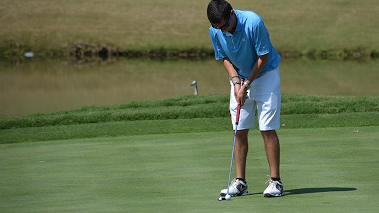 Brandon Dalinka lines up a short putt. UNC placed fourth in the Tar Heel Intercollegiate tournament this weekend at UNC Finley golf course.