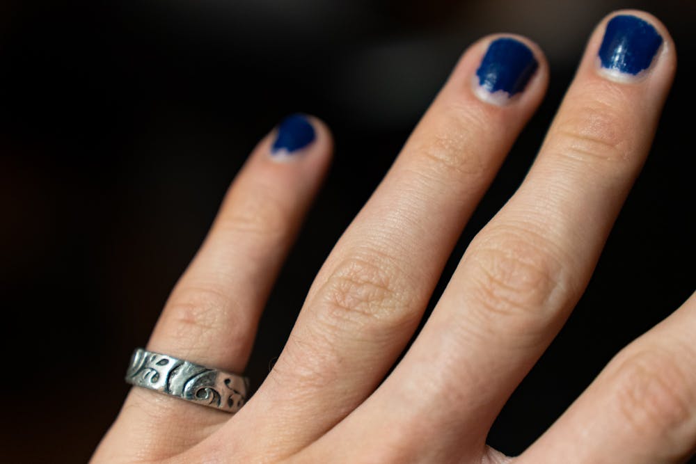 <p>DTH Photo Illustration. A UNC student wears a ring on his finger.</p>