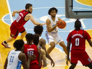 UNC first year guard RJ Davis (4) prepares to take a shot in the Smith Center during a game against NC State on Saturday, Jan. 23, 2021. UNC beat NC State 86-76.