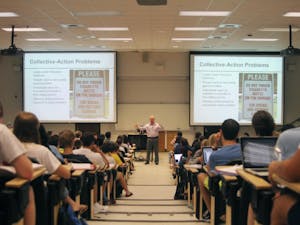 	Professor Jason Roberts lectures his very full Poli 100 class, which is one of the large lectures on campus, located in Hamilton Hall.