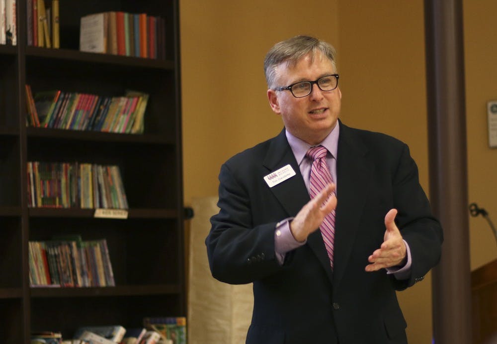 Tim Gaudette, an outreach manager of Small Business Majority, gave a presentation to a round-table of Chapel Hill and Carrboro small business owners at Flyleaf Books.