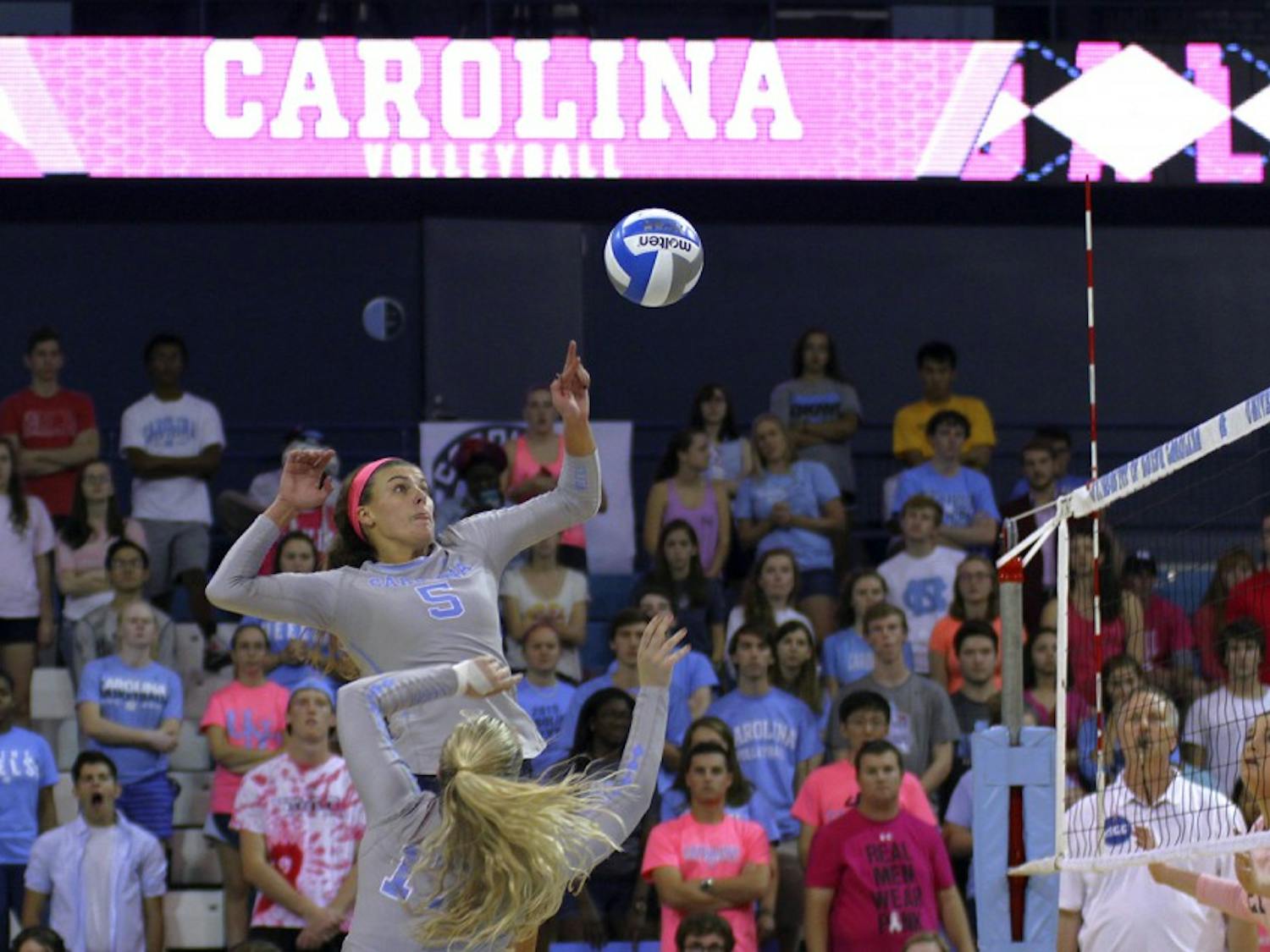 Paige Neuenfeldt spikes the ball for another point on Friday, Oct. 9