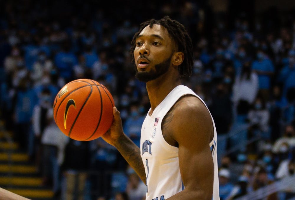 <p>Senior wing Leaky Black (1) looks for his teammates to make a pass in the game against Georgia Tech in the Dean E. Smith Center on Saturday, Jan 15, 2022.</p>