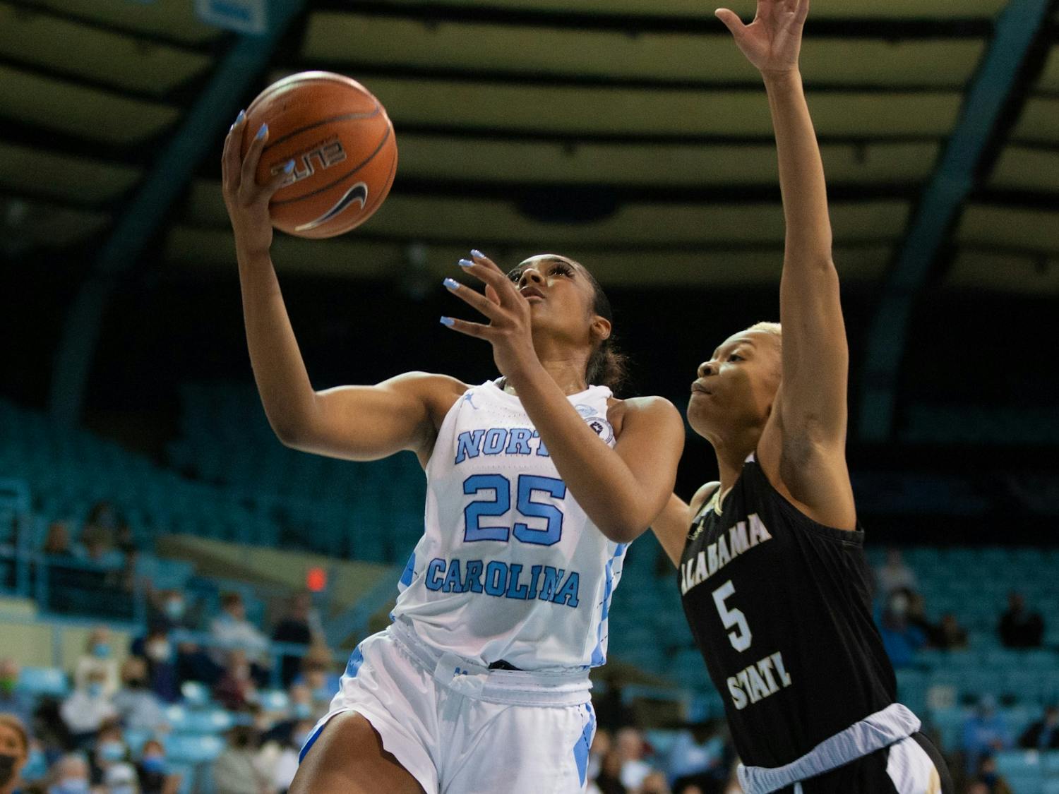 Sophomore guard Deja Kelly (25) shoots a layup at the game against Alabama State on December 21, 2021 at Carmichael Arena.