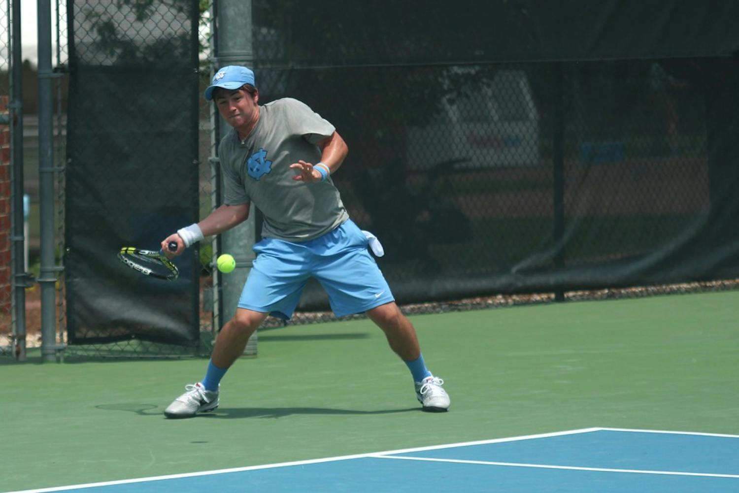 Ronnie Schneider returns the ball during the first round of the NCAA men's tennis tournament.