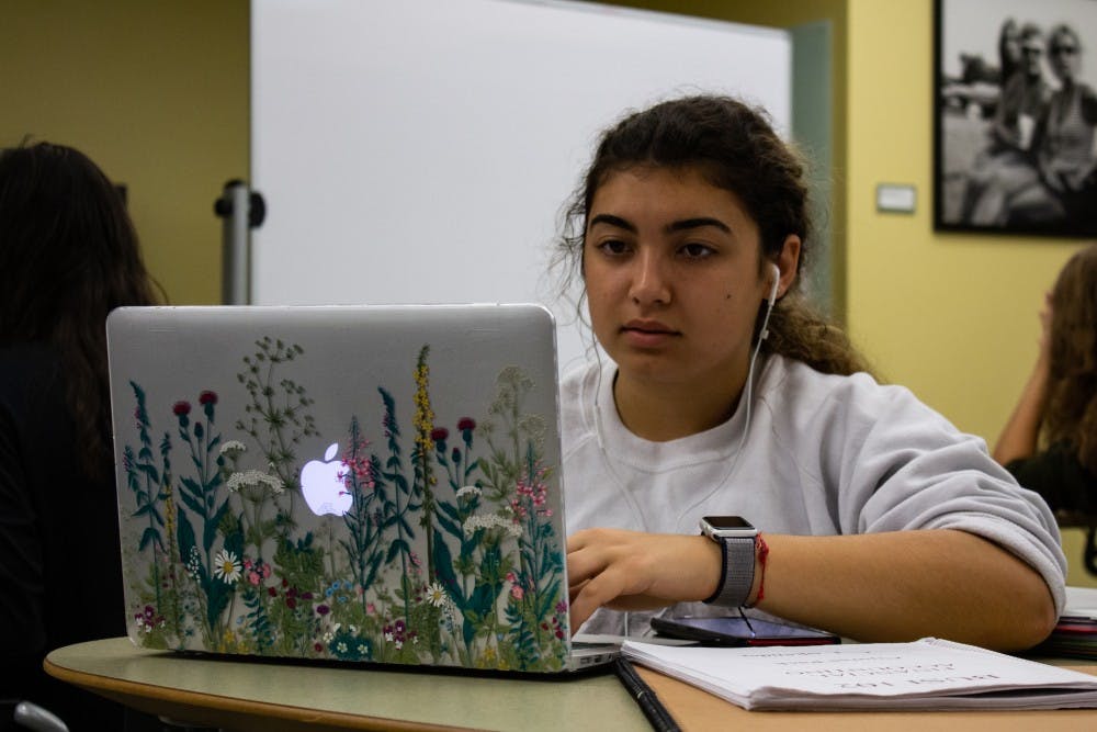 Emily Dawson, a sophomore global studies major, works on an assignment on her computer in the Undergraduate Library on Wednesday, Oct. 9th, 2019. 
