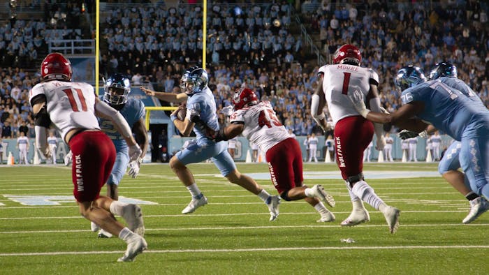 UNC red-shirt first-year, Drake Maye (10), gets sacked Kenan Stadium on Nov. 25, 2022, as the Tar Heels face off against the N.C. State Wolfpack. UNC lost 30-27.