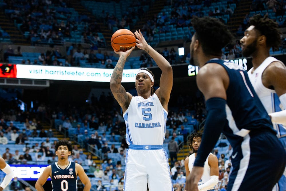 Junior forward Armando Bacot (5) shoots a free throw at the game against Virginia at the Smith Center in Chapel Hill on Jan. 8, 2022. UNC won 74-58.